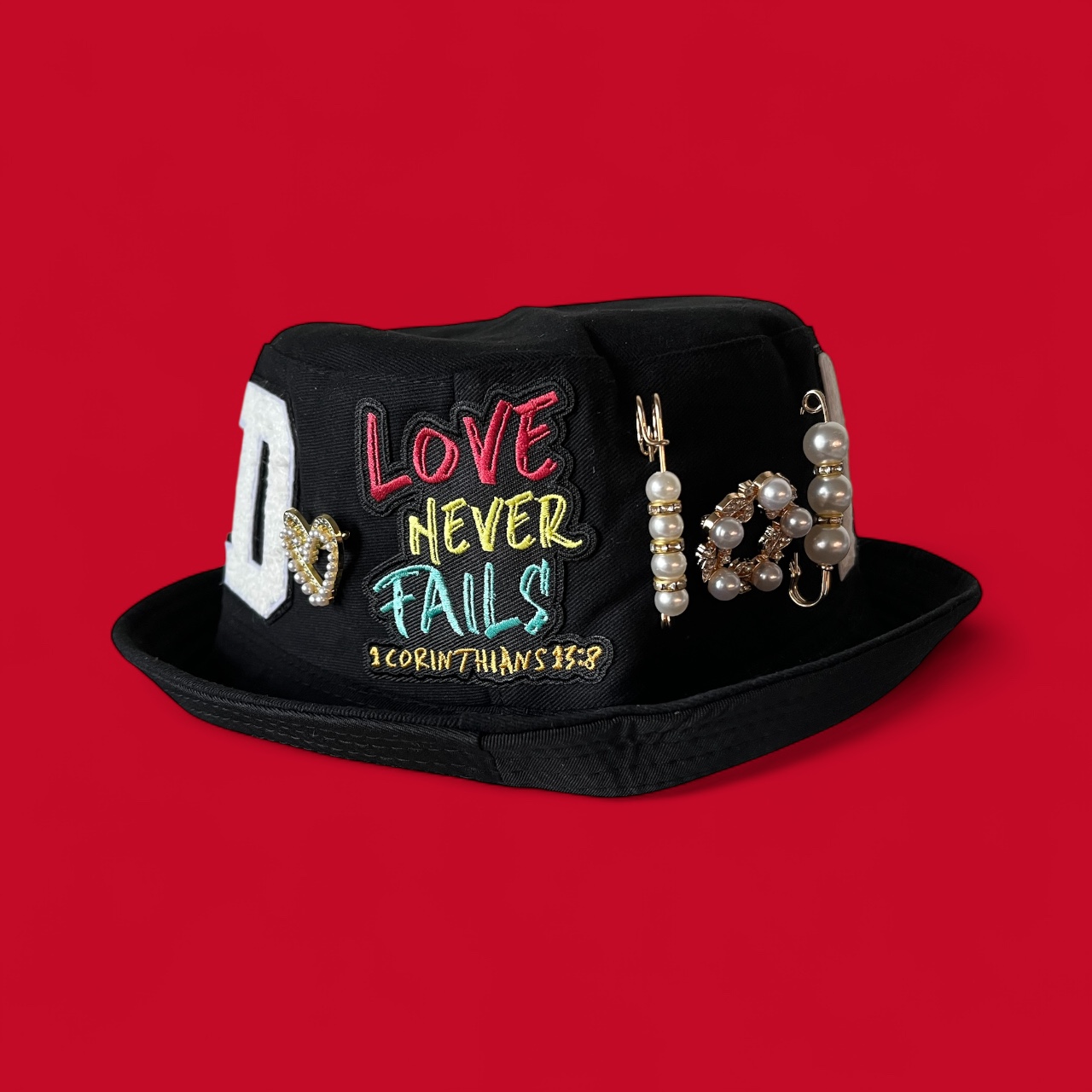 “Love Never Fails” bucket hat